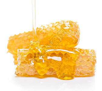 蜜蜂蜂窝荒野黄色蜂蜡液体金子细胞白色工作室食物药品图片
