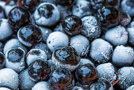 在一个碗里冰冻的阿罗诺尼娅窒息莓浆果苦莓宏观黑色健康黑果水果饮食浆果营养食物图片
