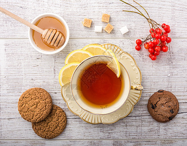 茶加柠檬木头饮食咖啡水果营养休息飞碟女性杯子食物图片