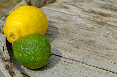 水果宣传单背景背景 柠檬 石灰和碳酸盐宏观传单乡村果汁食物横幅海报种子木板水果背景