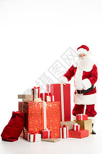 圣诞老人 带着一堆圣诞礼物节日白色庆典红色背景图片