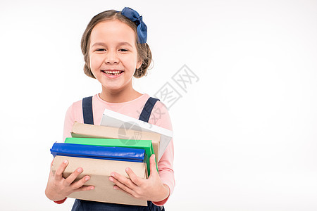 拥有书籍的女学生青春期理论小学意义成就瞳孔教育学校知识孩子图片