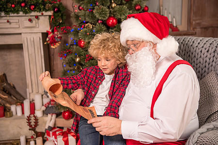 圣诞老人和儿童阅读愿望列表背景图片