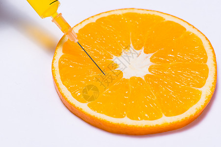 以橙色和针筒进行科学实验 将白纸隔离食物营养药品专家注射器免疫水果化学治疗绿色图片