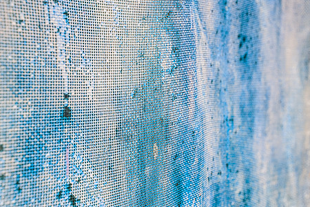在模糊的老生锈的滤网 炫彩花纹栅栏监狱安全边界金属正方形蓝色材料宏观障碍图片