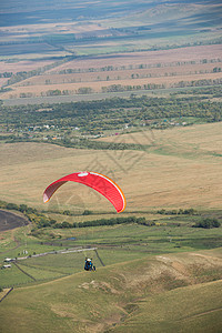 山岳的滑坡降落伞跳伞行动优胜者运动员活动天空飞机剪影跳伞员背景