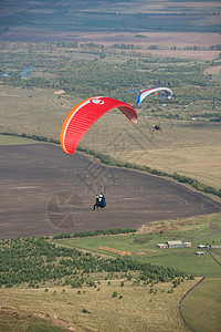 飞机剪影山岳的滑坡降落伞剪影肾上腺素跳伞竞赛蓝色飞机航班行动翅膀背景