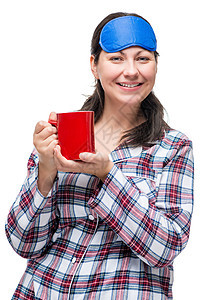 一个带着咖啡 穿着睡衣的微笑着女人的肖像图片
