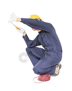 有一堆电线的电工 看不见的墙壁工人男性工作服务电缆金属修理工电气接线安全帽图片