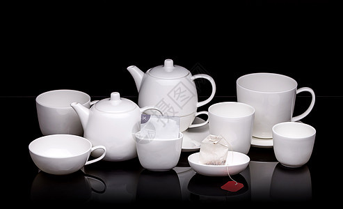 白瓷茶套餐具桌子陶瓷杯子盘子陶器茶碗制品黑色咖啡图片
