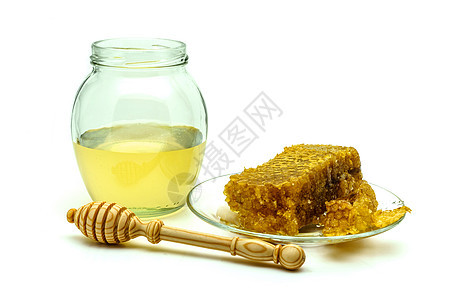 蜂蜜与蜂窝在玻璃板上隔离在白色背景早餐甜点糖浆药品蜂蜡厨房金子蜜蜂玻璃健康图片