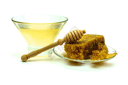 蜂蜜与蜂窝在玻璃板上隔离在白色背景甜点糖浆早餐蜂蜡产品食物药品厨房健康玻璃图片
