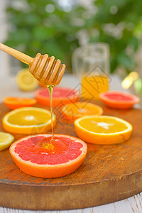 葡萄果 克莱门汀 橙和蜂蜜柠檬液体木头橙子柚子食物黄色宏观滴水图片
