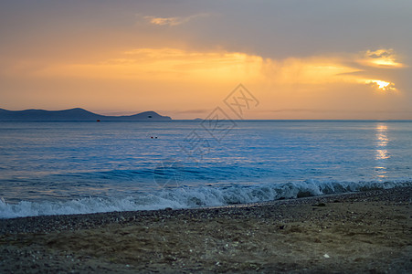 太阳在海洋上升起地平线日落场景天堂晴天海浪阳光太阳假期场地图片