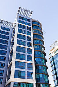现代建筑 有玻璃面罩镜子晴天刮刀投资反射财产太阳摩天大楼市中心窗户图片