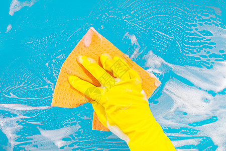 手用抹布打扫地面手套海绵窗户洗涤剂家务清洁工蓝色女性洗涤服务图片