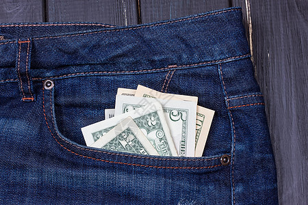 牛仔裤口袋里的美元贷款笔记现金商业金融财富账单纺织品棉布衣服图片