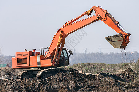 挖掘机地球天空工作红色商业工程师建筑海军力量电铲图片