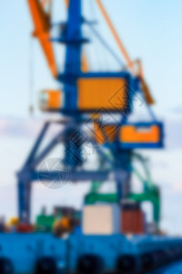 门式货物起重机模糊图像房间货运帆布黄色背景海报港口卡片蓝色摄影图片