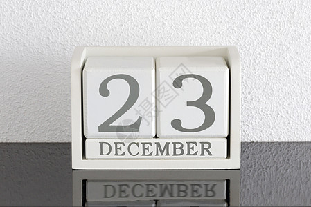 12月23日和12月目前白区块日历日期派对假期历史框架死亡黑色节日会议反射白色图片