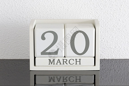 3月20日和2月目前白区块日历日期框架死亡假期历史节日派对白色会议黑色反射背景图片