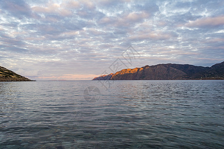 希腊克雷特Mochlos村的山岳与夜光海洋蓝色全景场景村庄顶峰旅行假期海岸海景图片