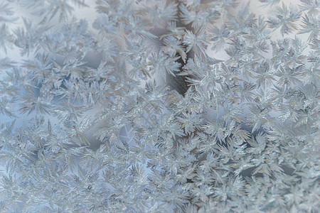 凝露为霜冷冻窗口大窗户季节气候结晶玻璃微光温度宏观火花蓝色背景