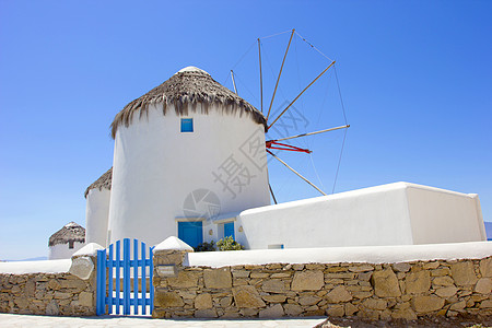 希腊的传统风车蓝天房子旅游教会岛屿晴天景点建筑学名人胜地图片