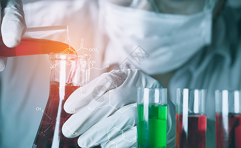 带有含液体的玻璃实验室化学测试管的研究员管子技术化学家瓶子乐器器皿学习测试微生物学蓝色图片