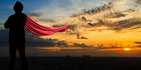 黄昏时的超级商务人士天空商务套装日落英雄领导者城市经理救主职业图片