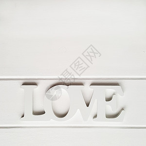 平整的桌子 有木制字母 Love在白色的照片上背景图片