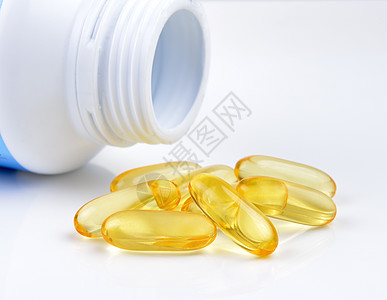 鱼油胶囊和容器白色药品制药鳕鱼瓶子医疗凝胶胶囊药店黄色图片