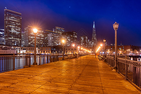 旧金山市中心天际帝国日落建筑学摩天大楼港口城市正方形刮刀商业海洋图片