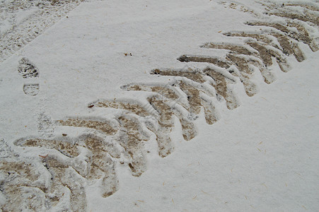 抽象冬季背景上从汽车轮胎 trea 的轨道的雪特写运输卡车状况后卫天气季节烙印版画橡皮沥青图片