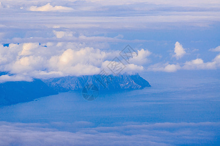 拉戈梅拉岛在西班牙特内里费云后蓝色地平线海滩天空海洋支撑旅游天堂海浪冲浪图片