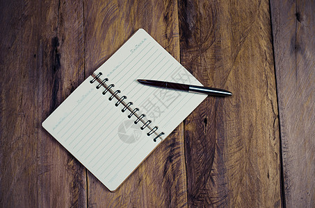 用笔在木制桌子上的空白笔记本  静止生命阅读软垫写作备忘录商业草图学习教育绘画铅笔图片
