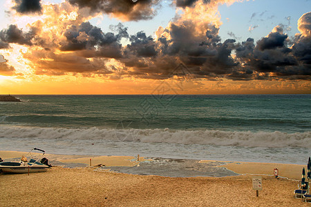 海滩日落团块灯塔橙子海洋泡沫公园码头太阳岩石旅行图片