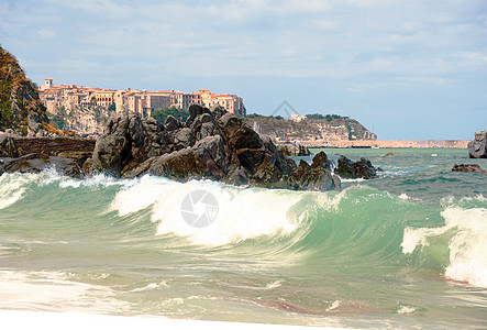 海滩日落晴天橙子海浪水晶海岸线旅行团块旅游灯塔风景图片