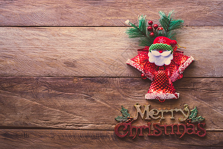 圣诞节庆祝活动的装饰品放在木头佛罗洛上假期红色礼物风格桌子松树星星季节性丝带装饰图片