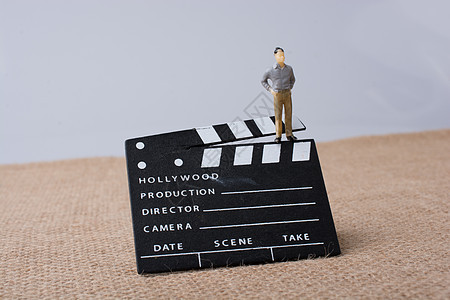 电影拍手和男雕像娱乐生产场景摄影师工作室相机行动隔板运动导演图片