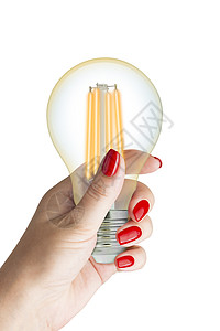 女性手上的LED纤维灯泡技术创造力创新生活身体指甲流明灯丝玻璃生态图片