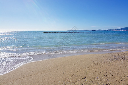 具有波残余形态的贱沙滩海洋天堂旅游海浪阳光闲暇生活季节海岸贝壳图片