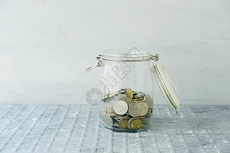 用硬币保存罐商业银行经济储蓄养老金收集生长瓶子兴趣玻璃图片