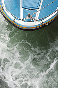 游快艇民众港口卸载蓝色发动机摩托艇乘客力量燃料码头图片