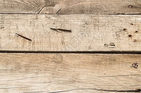 特写深色旧垃圾板深色木质背景与生锈的钉子木质纹理复古色调表面硬木橡木木材木工宏观风化地面墙纸裂缝木头图片
