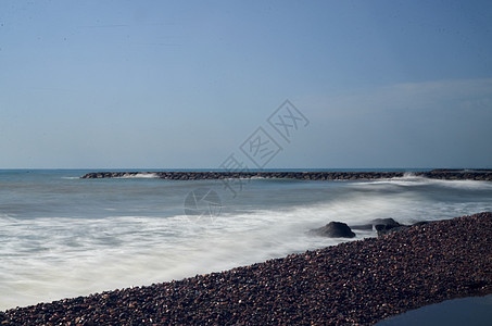 长期暴露于Puzol海滩海岸冲浪日出海浪运动天空薄雾辉光地平线阴霾图片