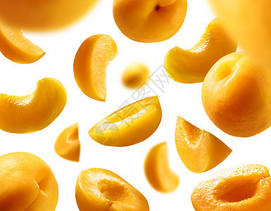 白背景的杏仁飘浮在白色背景上 在飞行中提取水果团体食物橙子剪裁航班宏观悬浮黄色图片