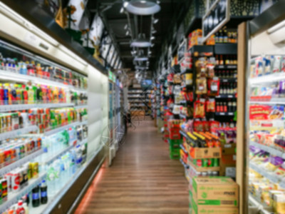 超市或杂货店产品架子模糊不清 使用店铺购物购物中心零售饮料顾客大车背景食物大卖场图片