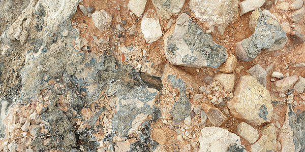海岸上多彩的地中海石块的纹理大理石蓝色材料棕色石英宝石化石岩石矿物地面图片