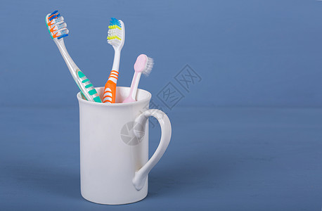 牙刷家庭蓝色塑料杯子洗手间牙医微笑化妆品女儿孩子图片